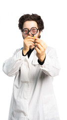 a strange doctor in funny glasses holds a pill and looks at it through a magnifying glass. the doctor examines the medicine