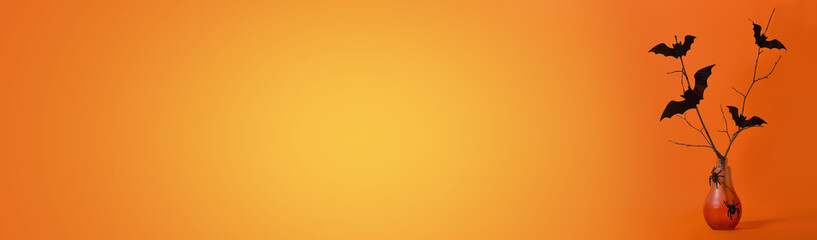 Halloween background. A red bottle shaped like a lamp with branches, bats and spiders.Trick or treat. Banner. Copy space for text