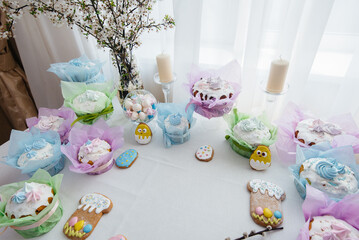 Beautiful Easter cakes on a decorated light table. A light holiday of Easter.