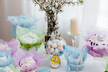 Beautiful Easter cakes on a decorated light table. A light holiday of Easter.