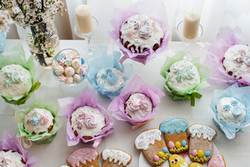Beautiful Easter cakes on a decorated light table. A light holiday of Easter.