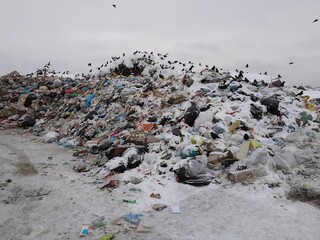 
there are a lot of whole mountains of household garbage at the landfill of household garbage, not sorted garbage, environmental damage