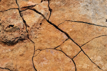Crack in the sandstone texture closeup, fracture. benagil beach in Portugal.