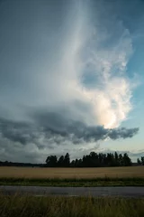 Fotobehang clouds over the field © Joakim Kuylenstierna