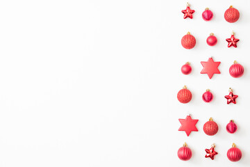 Flat lay pattern with christmas balls and decorations on a white background