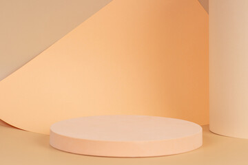 Abstract trendy composition with empty round podium platform for product presentation and curve shaped paper on pastel beige background. Front view