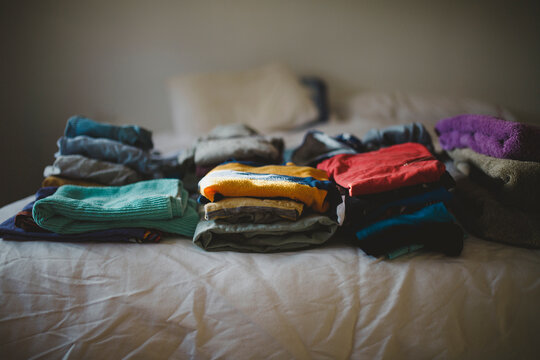 Piles of freshly washed and folded clothes