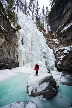 Hiker Exploring Frozen Maligne Canyon