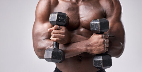 Fototapeta na wymiar technique of doing an exercise with dumbbell of cropped muscular strong african american sportsman isolated on white studio background, portrait. sport and motivation concept. bodybuilding, fitness