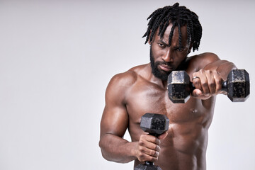 Fototapeta na wymiar well-built athlete preparing for training, close up portrait, holding dumbbells, isolated over white studio background, posing at camera confidently. healthy lifestyle, bodybuilding, weightlifting