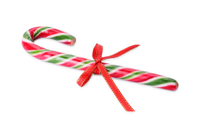 Sweet Christmas candy cane with red bow on white background