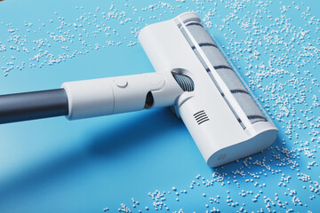 The nozzle of the turbo brush of a modern vacuum cleaner on a blue background cleans garbage.