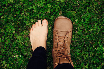 Person wearing barefoot boots shoes, which are wide, comfortable and healthy concept. Wide toe box...