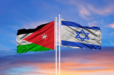 Jordan and Israel two flags on flagpoles and blue cloudy sky
