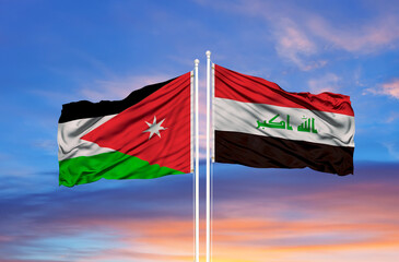 Jordan and Iraq two flags on flagpoles and blue cloudy sky