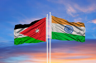 Jordan and India flag waving in the wind against white cloudy blue sky together. Diplomacy concept, international relations.
