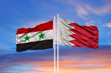 Bahrain and Syria two flags on flagpoles and blue sky
