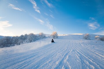 Vacationers at the resort tourists in the valley go snowboarding and skiing
