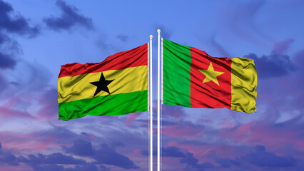 Ghana and Cameroon two flags on flagpoles and blue sky