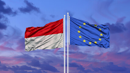 Indonesia and European Union two flags on flagpoles and blue cloudy sky