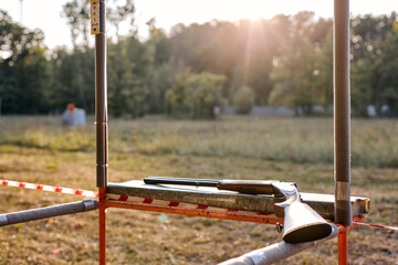 Weapon. gun for shooting training lying ready to fire, copy space. in outdoor shooting range at...
