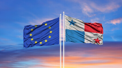 European Union and Panama two flags on flagpoles and blue cloudy sky