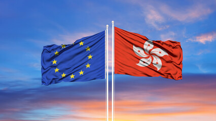 European Union and Hong Kong two flags on flagpoles and blue cloudy sky