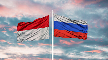 Indonesia and Russia two flags on flagpoles and blue cloudy sky