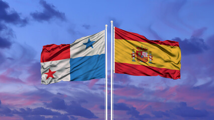 Spain and Panama two flags on flagpoles and blue cloudy sky