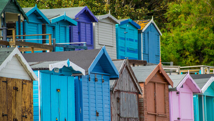 Fototapeta na wymiar Colorful Beach Huts in the traditional British seaside resort of Walton On the Naze Essex