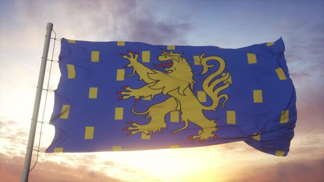 Franche-Comte flag, France, waving in the wind, sky and sun background
