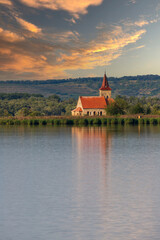 Nove mlyny reservoir and in the background the flooded church of St. Linhart and Palava with the ruins Divci Hrady in the Czech Republic.