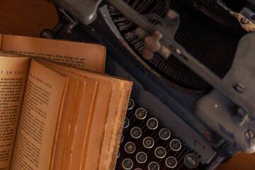 vintage camera old typewriter and literature books on wood table - Powered by Adobe