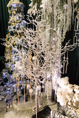 Side view of Christmas decorations with toys, garlands in white colors