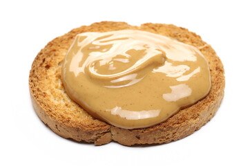Peanut butter spread on slice of bread isolated on white background