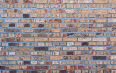 Colorful clinker brick wall with different stones, top view, texture Background wallpaper