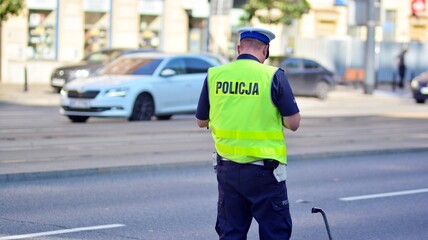 Car crash accident on street. Policeman  takes notes after accident.  