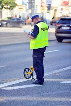 Car Crash Accident On Street. Policeman  Takes Notes After Accident.  