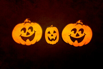 Halloween decor. Orange paper craft pumpkins.