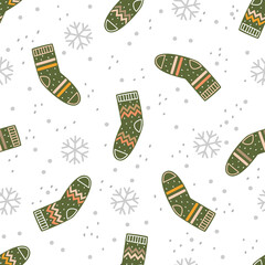 Green socks and snowflakes on a black background. Vector seamless pattern