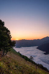 amazing sunrise in the ossau valley. magnificent sea of clouds in the valley.  portrait format shot