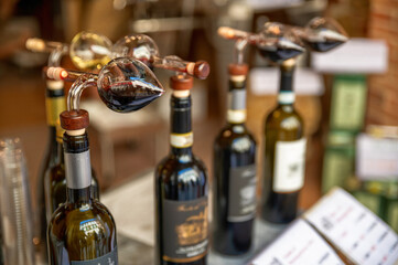 Montepulciano, Tuscany, Italy.August 2021. Close up shot of bottles with cruet for tasting in a...