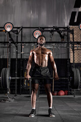 Fototapeta na wymiar sport, bodybuilding, lifestyle and people concept. young black african american man with barbell is going to flex warm up muscles, powerlifter is engaged in bodybuilding cross fit.