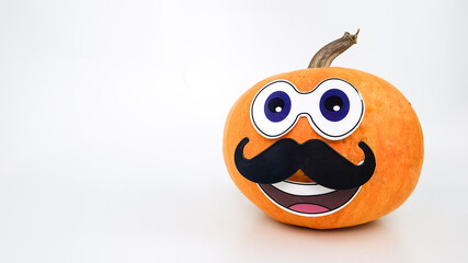 isolated on white image of a pumpkin with a mustache, eyes and a smile. thanksgiving cards.