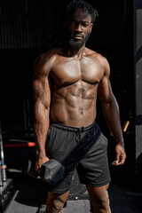 Fototapeta na wymiar powerful black athletic men pumping up muscles workout bodybuilding concept. muscular bodybuilder handsome man doing exercises with dumbbell in gym, with naked torso fitness and bodybuilding workout