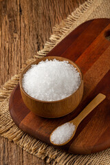 Fototapeta na wymiar Coarse salt in bowl on wooden background.