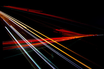 Night road lights. Lights of moving cars at night. long exposure red, blue, green