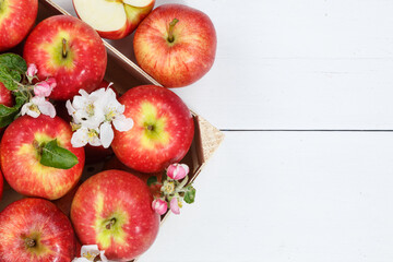 Apples fruits red apple fruit with leaves from above with copyspace copy space on a wooden board