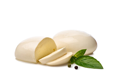 Pieces of fresh mozzarella cheese with basil leaves on white