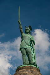 Close up of the famous Hermannsdenkmal (Hermann's Monument) against a cloudy blue sky on the Grotenburg mountain near Detmold, Teutoburg Forest, Germany